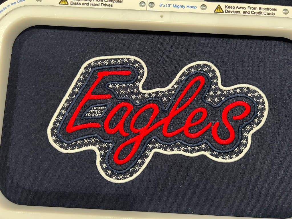 Allen Eagles custom embroidered applique on jackets — booster club order