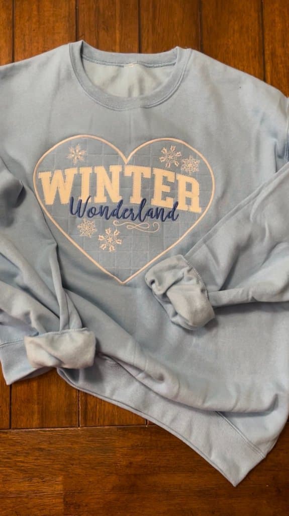 Custom screen-printed Winter Wonderland event sweatshirt
